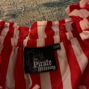 Red and white stripes. Very cute. Great for Halloween or any other occasion!